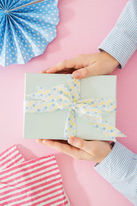 Midsection of woman holding paper in box