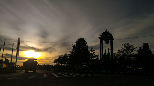 Silhouette of building at sunset