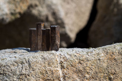 Close-up of stack of rocks against wall