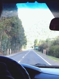 Road seen through car windshield