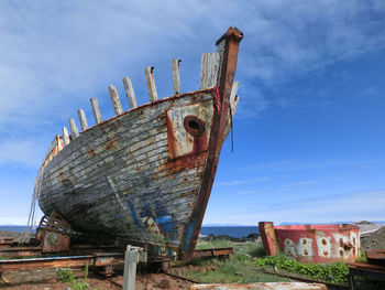 Abandoned ship against sky
