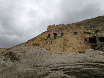 Low angle view of old building against sky