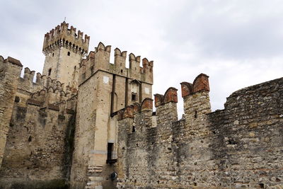 Low angle view of old ruins against sky