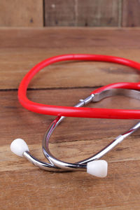 Close-up of stethoscope on wooden table
