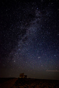 Scenic view of star field against sky at night