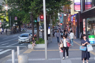 People walking on street in city