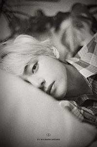 Close-up portrait of baby lying down on bed