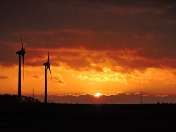 Silhouette of landscape against dramatic sky