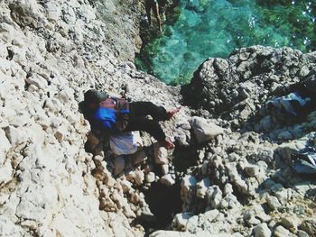 Woman standing on rocks