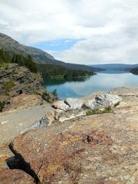 Scenic view of lake against cloudy sky