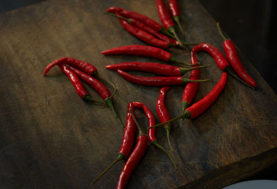 Close-up of red chili peppers on table
