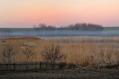 Scenic view of landscape against sky during sunset