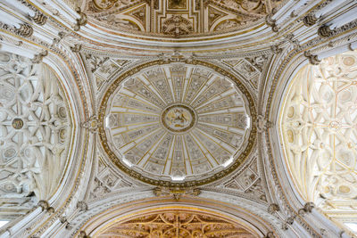 Low angle view of ornate ceiling of building