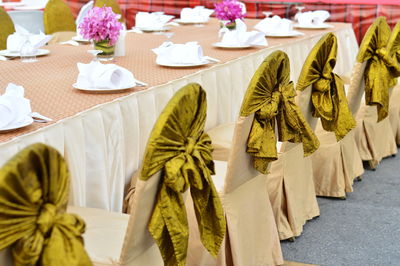 Close-up of arranged dining table at wedding ceremony