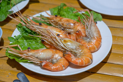 High angle view of fish in plate on table