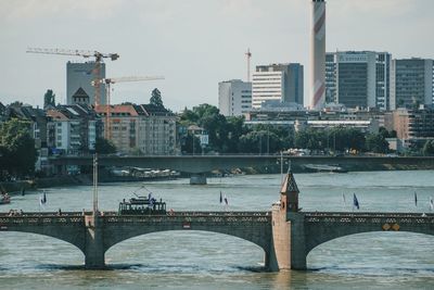 View of bridge over river in city