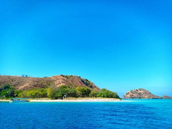 Scenic view of sea against clear blue sky