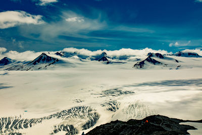 Scenic view of snowcapped mountains against sky