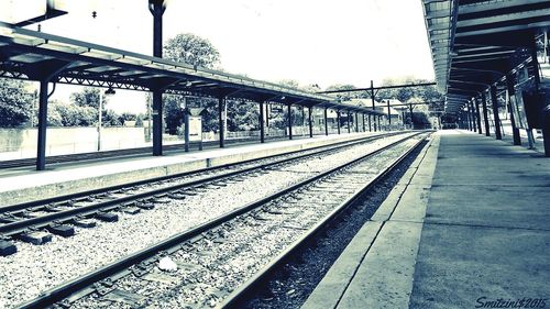 Railroad tracks on railroad station platform