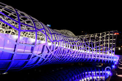 Illuminated ferris wheel at night