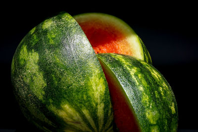 Close-up of oranges over black background