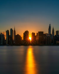 Illuminated city at waterfront