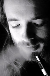 Close-up of man smoking