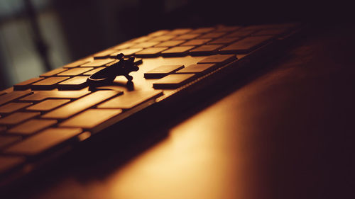 Close-up of ring on computer keyboard at table