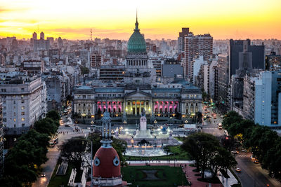 High angle view of city at sunset