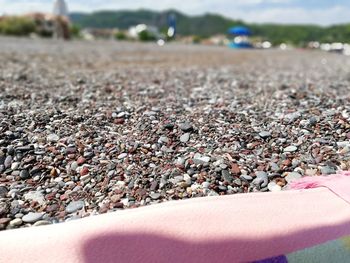 Close-up of hand on pebbles
