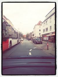 Road with buildings in background