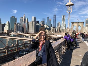 A smiling girl on the bridge smiling