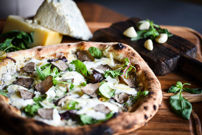 Close-up of pizza on cutting board