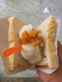 Close-up of hand holding ice cream