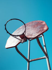 Low angle view of basketball hoop against blue sky