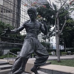 Statue against trees in park