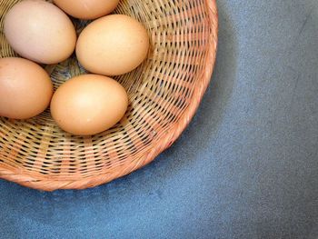 High angle view of eggs in basket