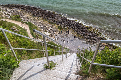 High angle view of staircase by sea