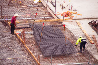 High angle view of men working at construction site