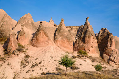 Panoramic view of rocks in desert against sky