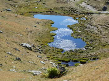 Scenic view of little alpine lake near colle del preit