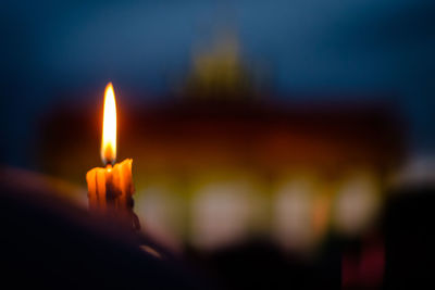 Close-up of lit candle in fire