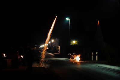 Firework on road in city at night