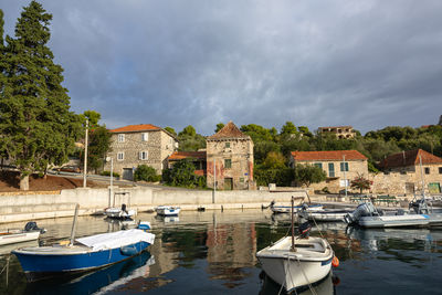 Boats in sea against sky