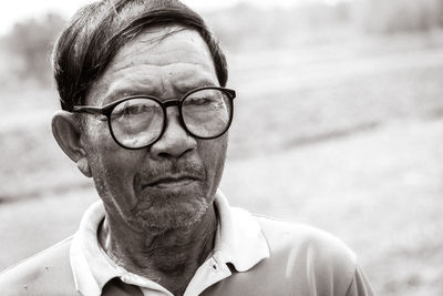 Portrait of man wearing eyeglasses