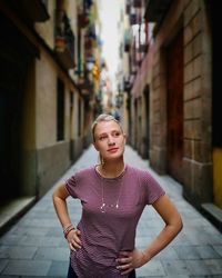 Portrait of woman standing in city