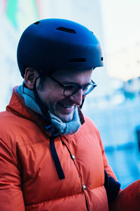 Smiling man wearing warm clothing and helmet