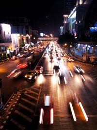 Blurred motion of vehicles on road at night