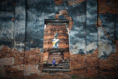 Graffiti on brick wall of building