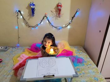 Portrait of girl on bed at home